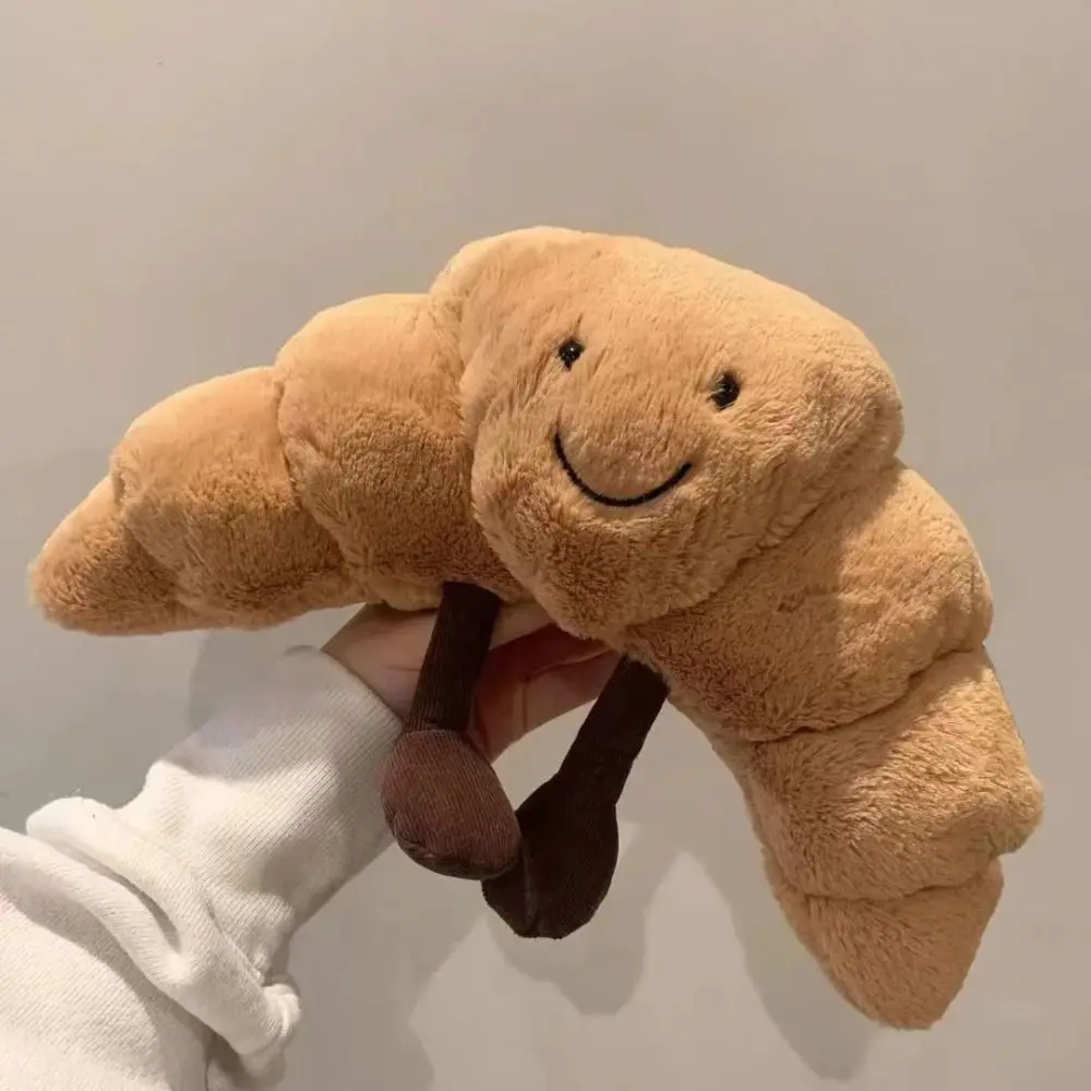 Creative Plush Croissant น่ารัก Smile Croissant ขนมปังหมอนตุ๊กตาสัตว์ตลกอาหาร Plushies ของเล่นสําหรับของขวัญเด็ก