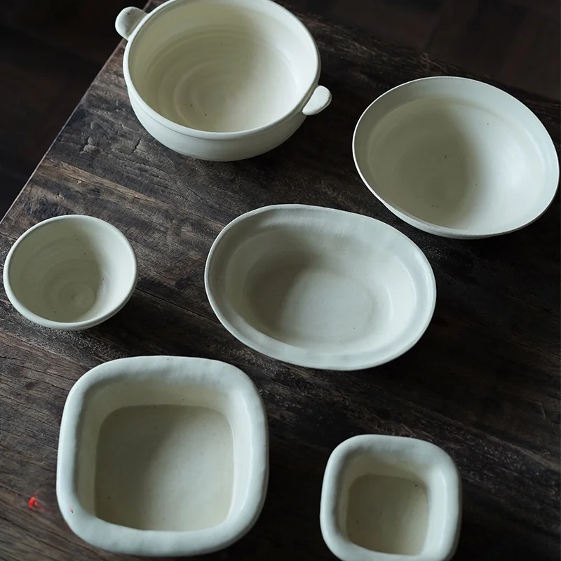 

Набор посуды Amu Handmade: теплый желтый фарфор, матовая глазурь, нерегулярные формы, тарелки, миски, столовые приборы, высокотемпературная обжигка.