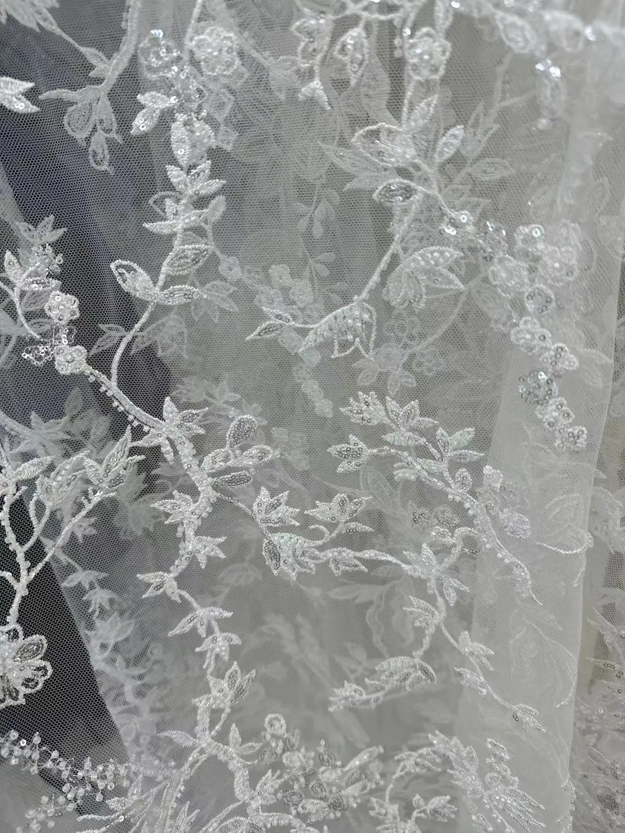 

The latest white African lace fabric with high-quality sequins and embroidery for a French tulle lace Nigerian wedding dress sew