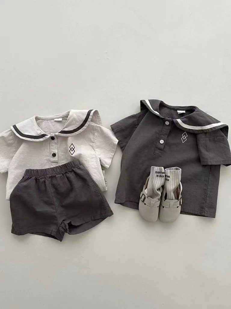 Conjunto de ropa de manga corta para bebé, pantalones cortos informales para niño y niña, traje de cuello azul marino con patrones geométricos,