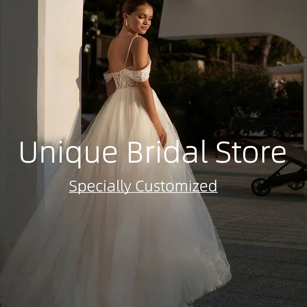 Abiti da sposa sexy personalizzati Cinghie per spaghetti con spalle scoperte Sweep Train Tulle di alta qualità per le donne Nuova moda Bri