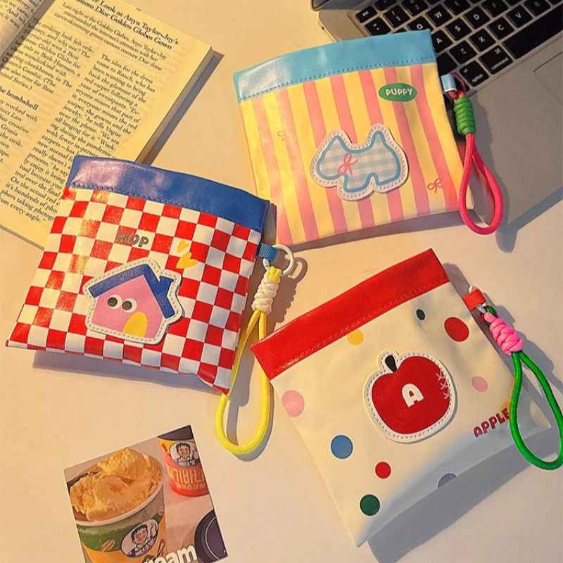 Dopamine PU makeup pouch with woven strap, holds pads, lipstick, coins & earbuds, cute portable for students & commute.
