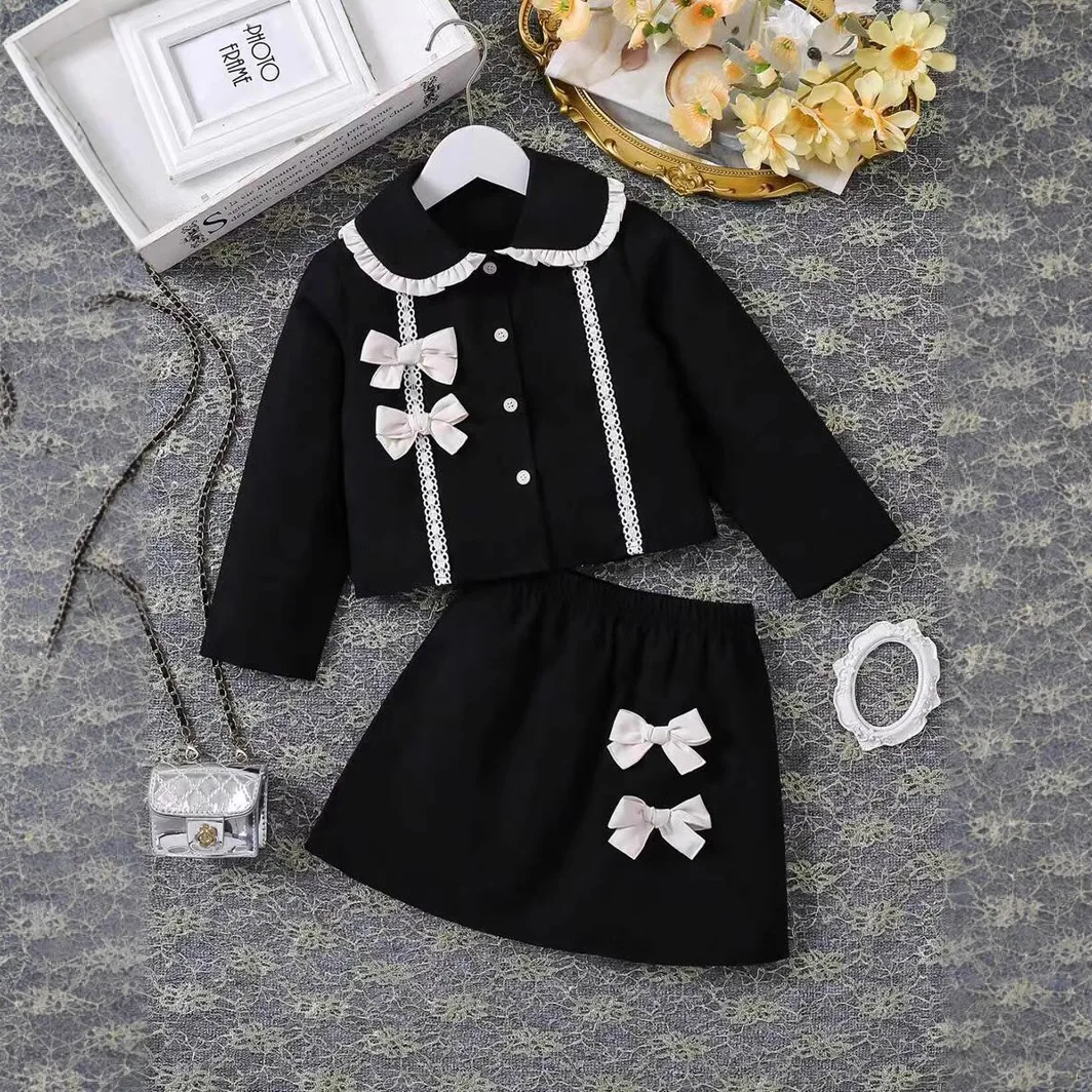 Conjunto de dos piezas de chaqueta de manga larga con botones laterales y cuello Peter Pan negro para niñas de moda europea y americana
