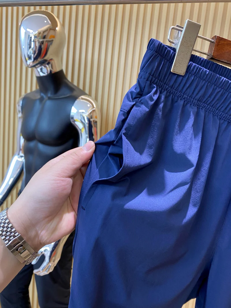 Leve qui calças de pele seca ao ar livre dos homens calças casuais novo verão 2024 cor pura respirável ajuste confortável