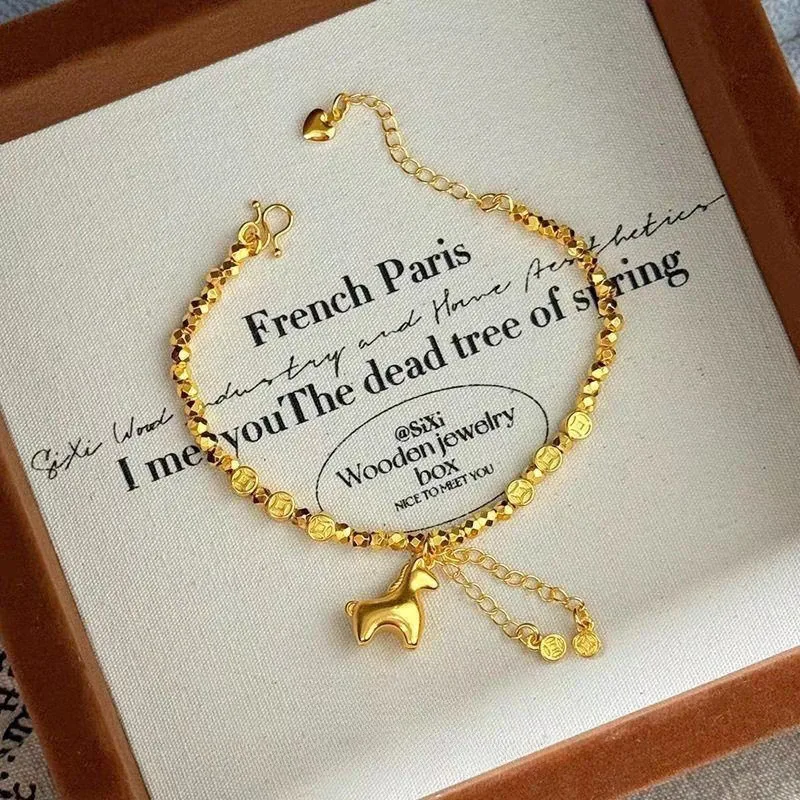 

New immediately rich burst flash bouncy beads pony copper money bracelet ladies 999 real gold gold hand jewelry