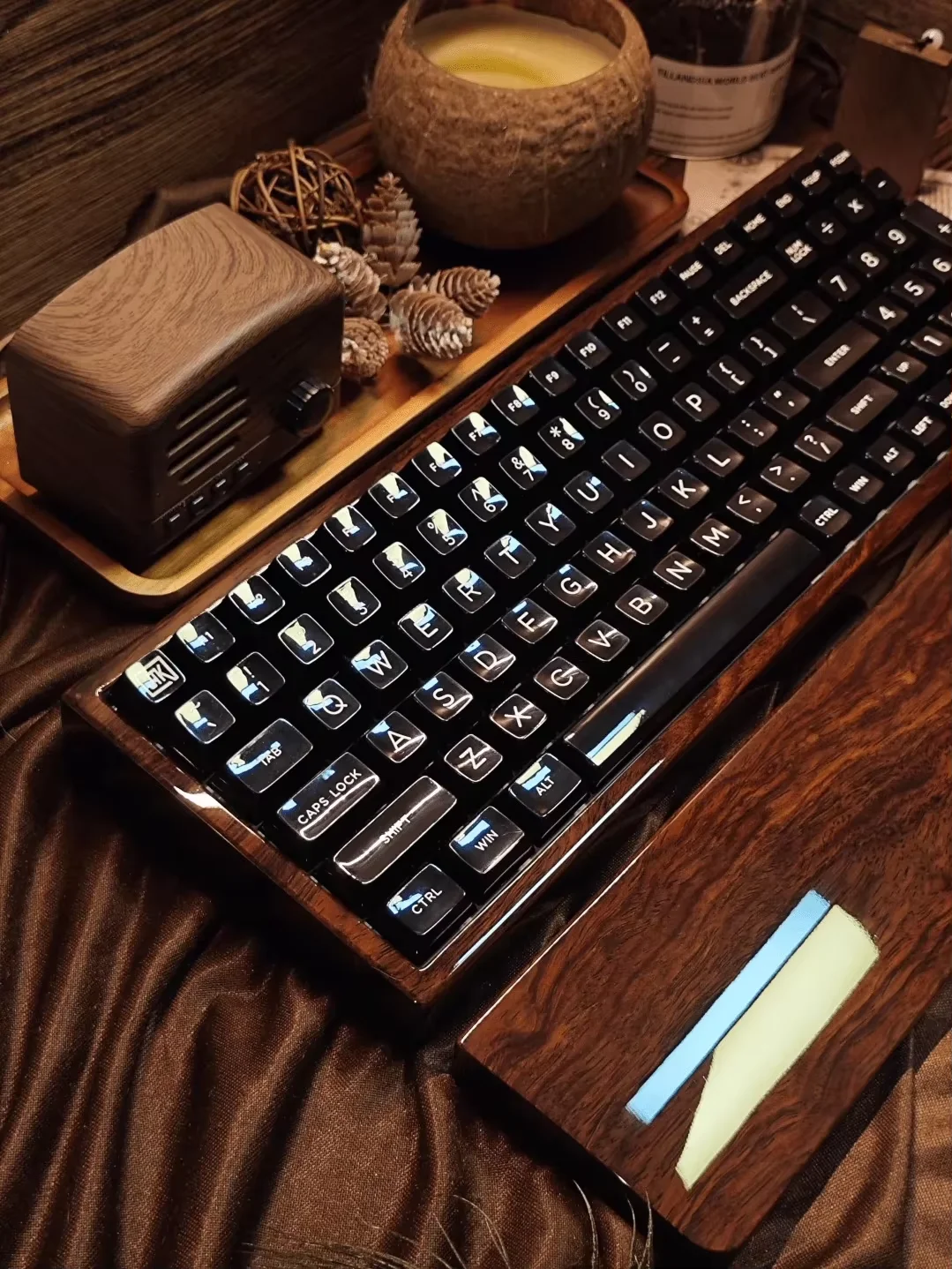 Three-mode mechanical keyboard with RGB lighting, made of African ebony wood and featuring a piano lacquer finish.