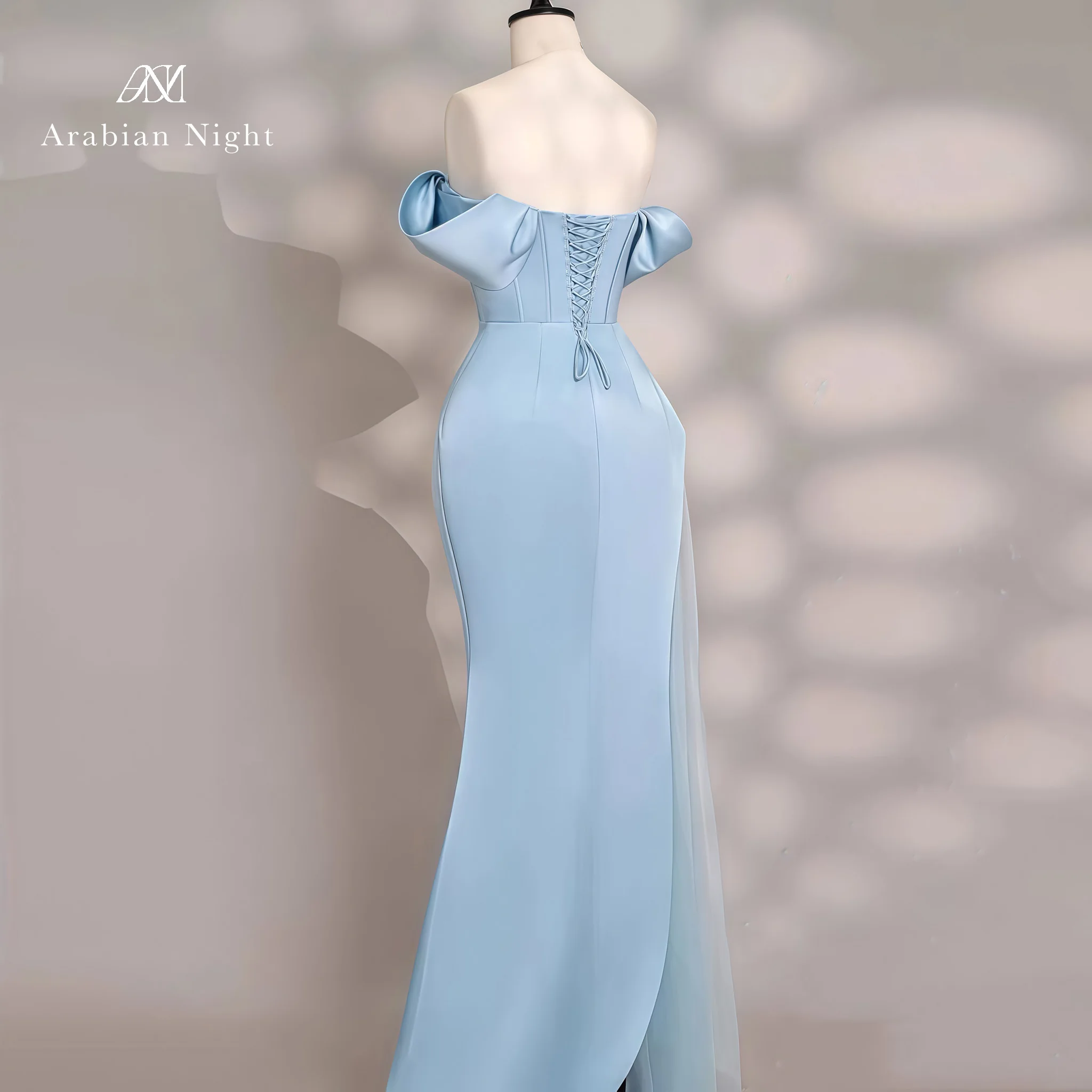 Blue off-the-shoulder strapless sleeveless mermaid formal gown featuring a boned bodice beadwork and a slit skirt