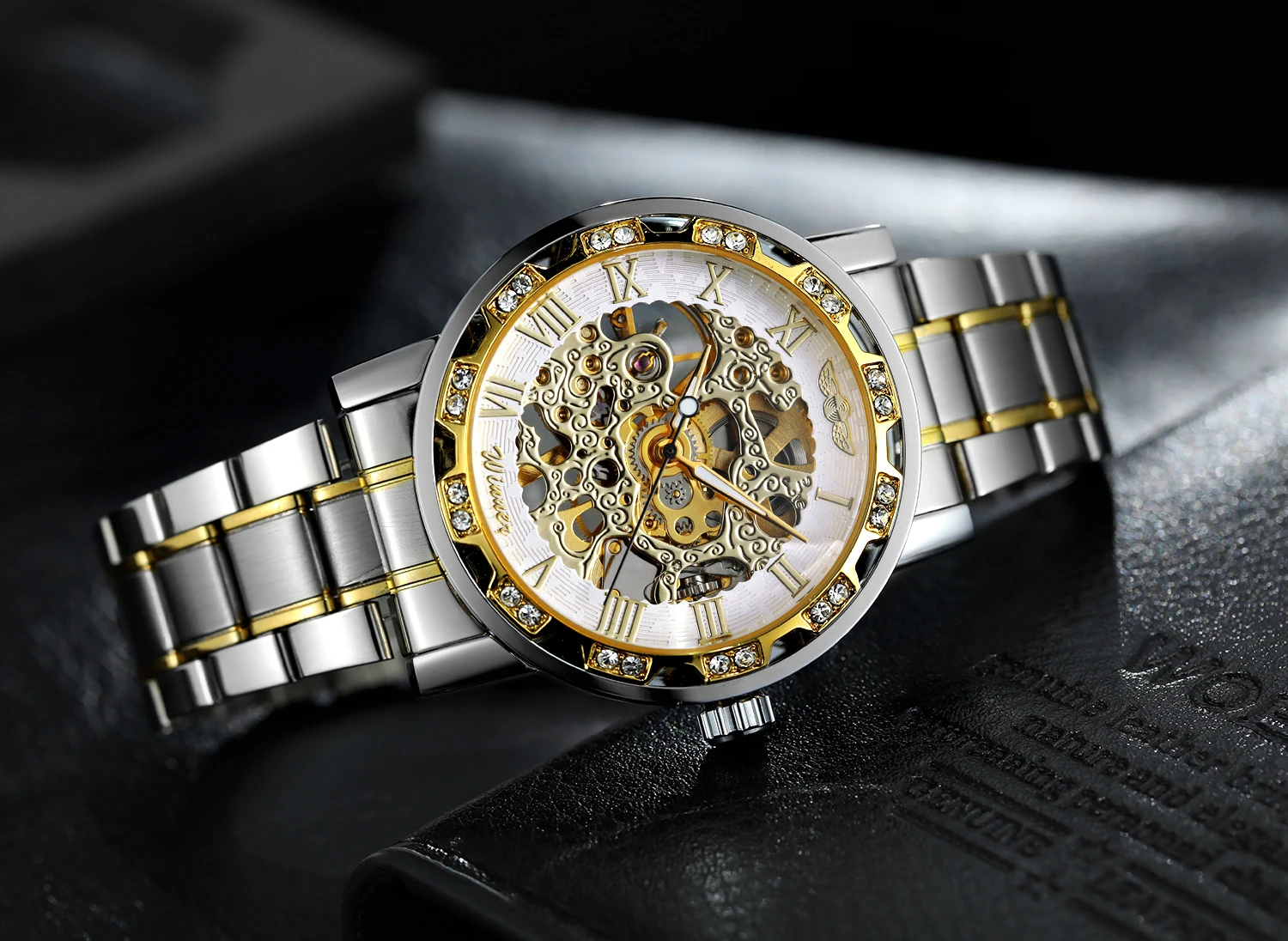 T-WINNER แฟชั่นผู้ชายลำลองโครงกระดูกนาฬิกาเครื่องกลแกะสลักตัวชี้ส่องสว่างหรูหราไรน์สโตนสีเงินผู้ชายนาฬิกาข้อมือ