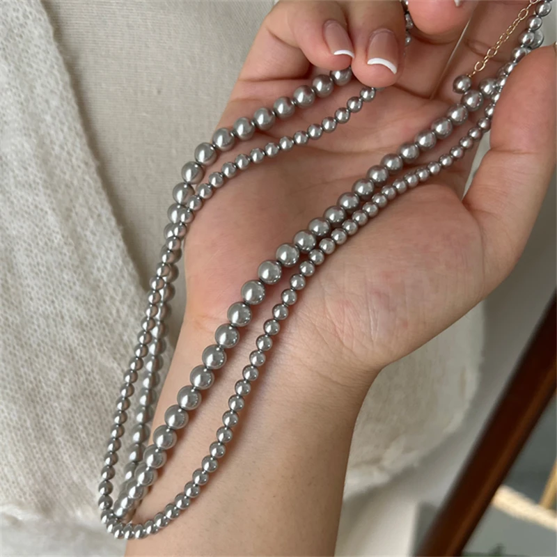 2024 New Fashion Women\'s Grey Round Glass Pearl Sweater Chain Necklace Beaded Clavicle Necklace Wholesale