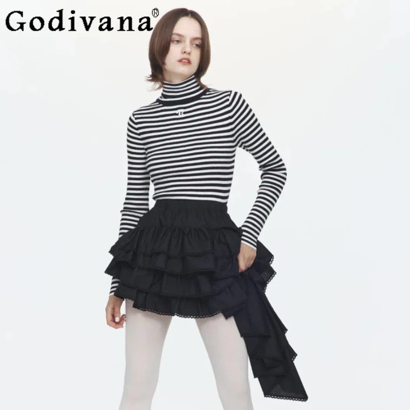 تنورة قصيرة غير منتظمة على الطراز الياباني لعام 2025 لربيع وخريف المرأة بخصر مطاطي من الدانتيل تنورة كعكة على شكل حرف v سترة يومية للسيدات