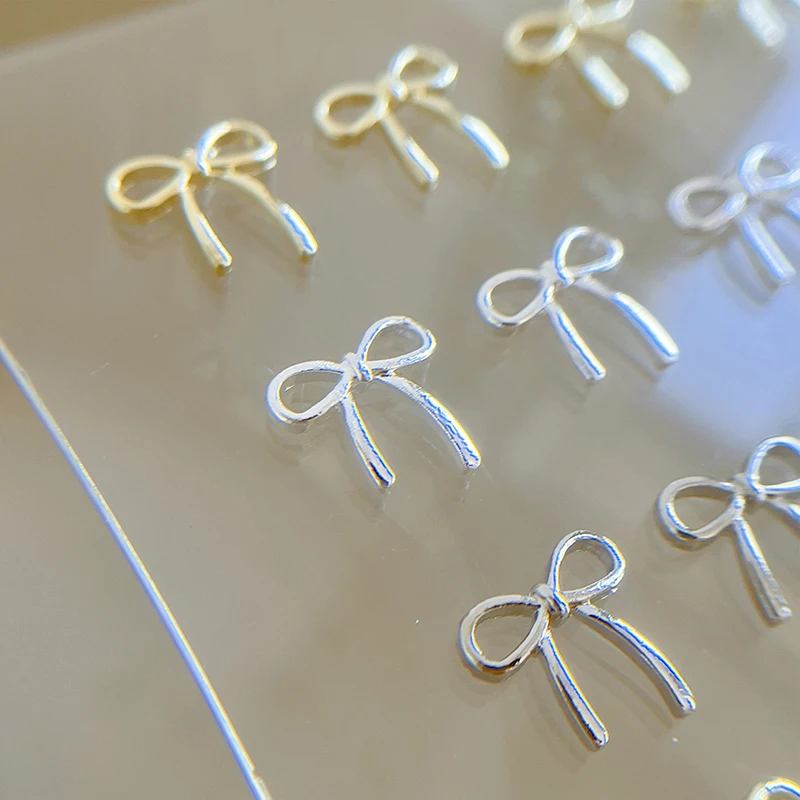 10 sztuk kokarda Deco Nail Art Charm 3D srebrna/złota kokardka wstążka części do dekoracji paznokci DIY luksusowe akcesoria do Manicure