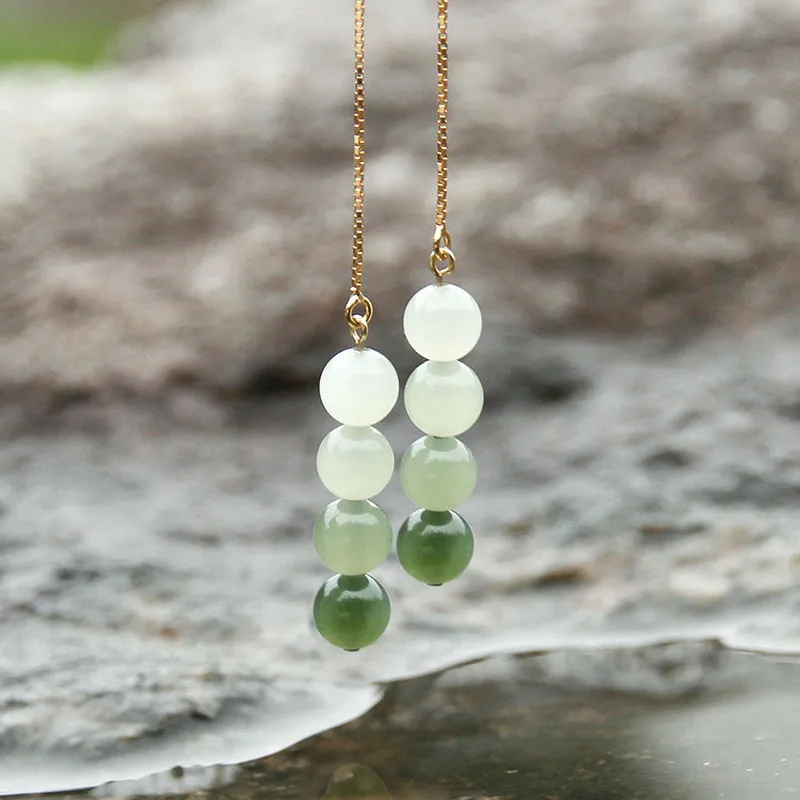 Hetian jade , featuring a gradient color design with beaded elements, in style of ethnic earrings, ear threads, and