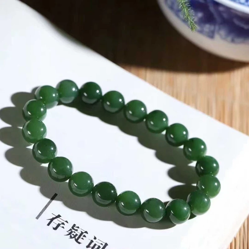 

Natural Hotan Russian Material Old Spinach Green with Slight Black Spots Jade Bracelet