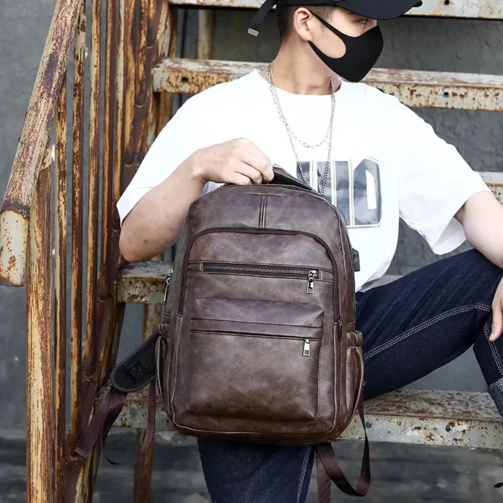 

Casual waterproof leather material shoulders backpack men Korean version multifunctional outdoor computer campus bag