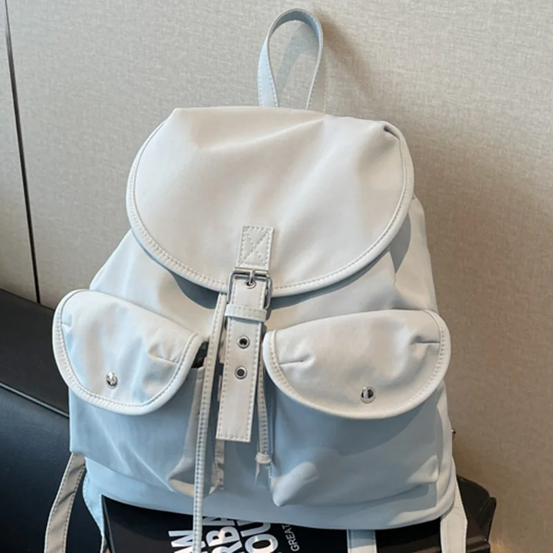 

2026 New Women's Nylon Backpack Fashion Flap Drawstring Double Pocket Casual Commute Travel School Bag Light Blue