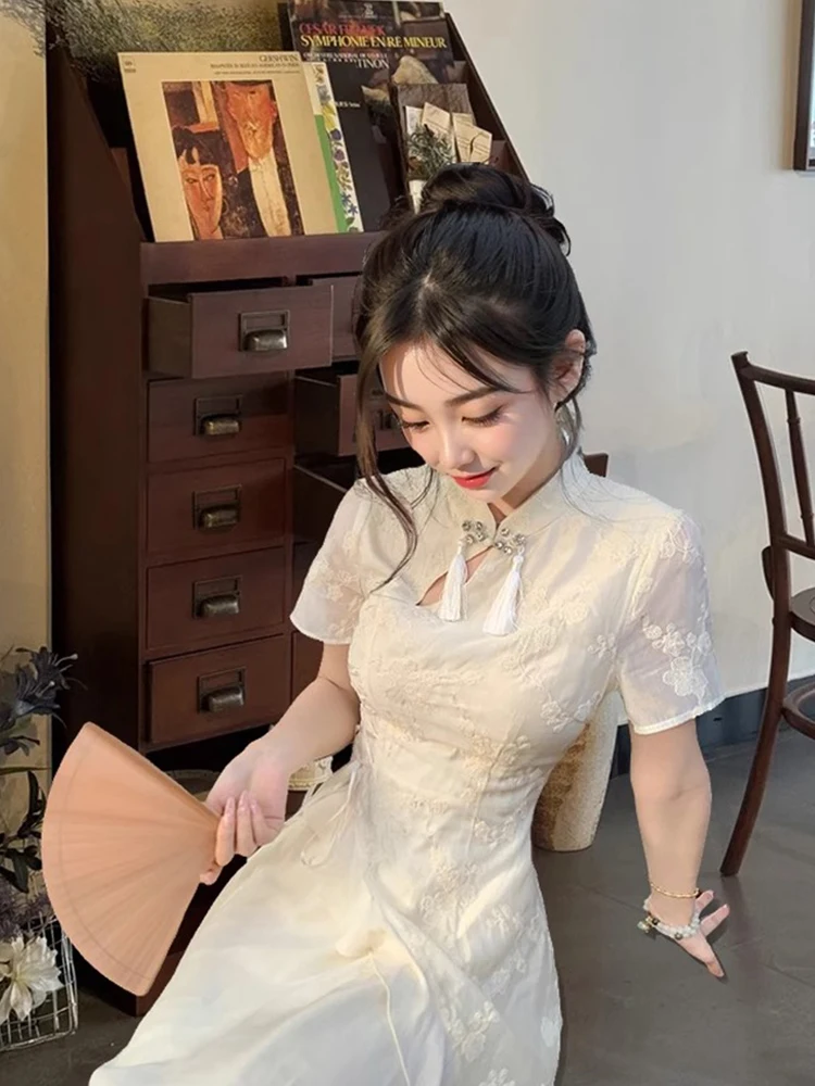 Estate 2025 Nuovo spirito nazionale cinese Sle ricamato floreale colletto alla coreana orlo asimmetrico abito Midi Dr