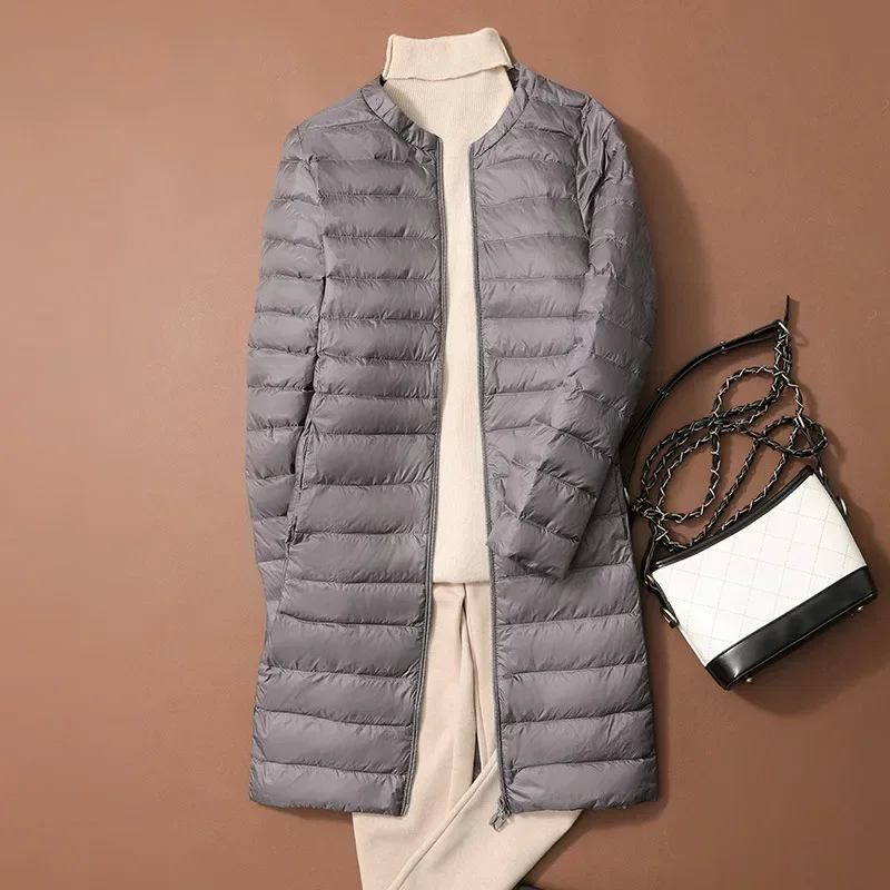 Abrigo-Chaqueta acolchada sin cuello con cuello redondo de estilo coreano de otoño/invierno con forro de plumas cálido nuevo plumón de pato largo ultraligero para mujer