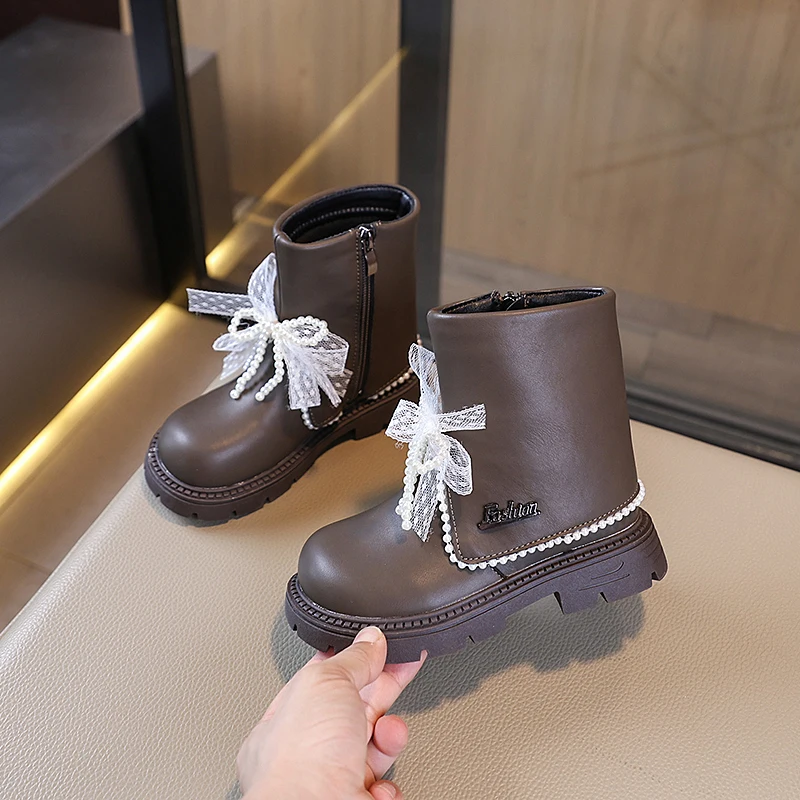 2025 nouvelles filles bottes doublées en peluche mode arcs perles conception enfants chaussures d'hiver haut antidérapant luxe enfants botte en cuir