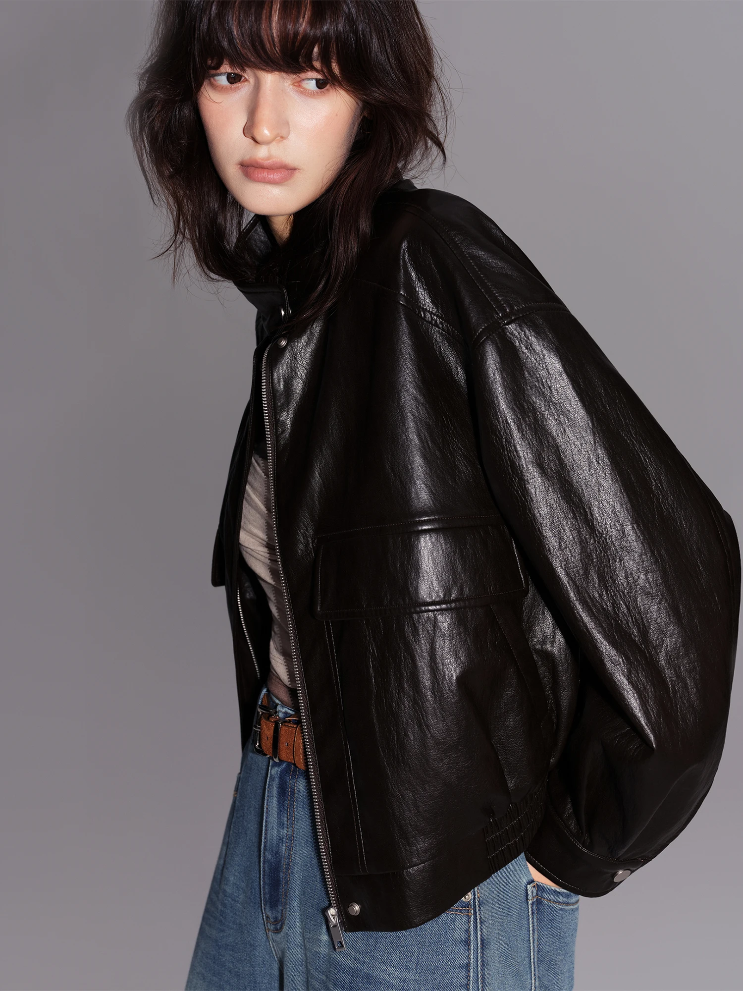 ZIQIAO Women's 2026 Fall New Textured Faux PU Leather Jacket Dropped Shoulders Stand Collar Design Short Coat with Large Pockets