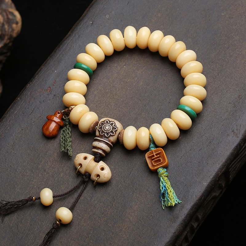 Yak Bone Bead Bracelet With Turquoise Spacers, Three-Way Clasp, And Cloud Pendant Accessories
