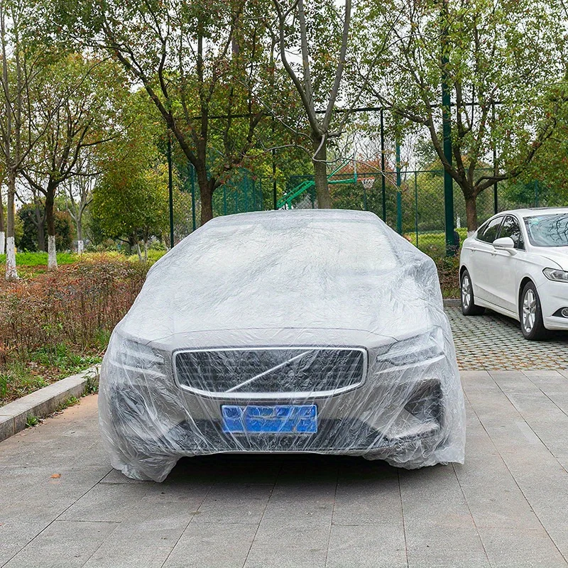 Transparent PE material car cover fitting design, fully protecting the vehicle from sun, rain, and dust, disposable car cover