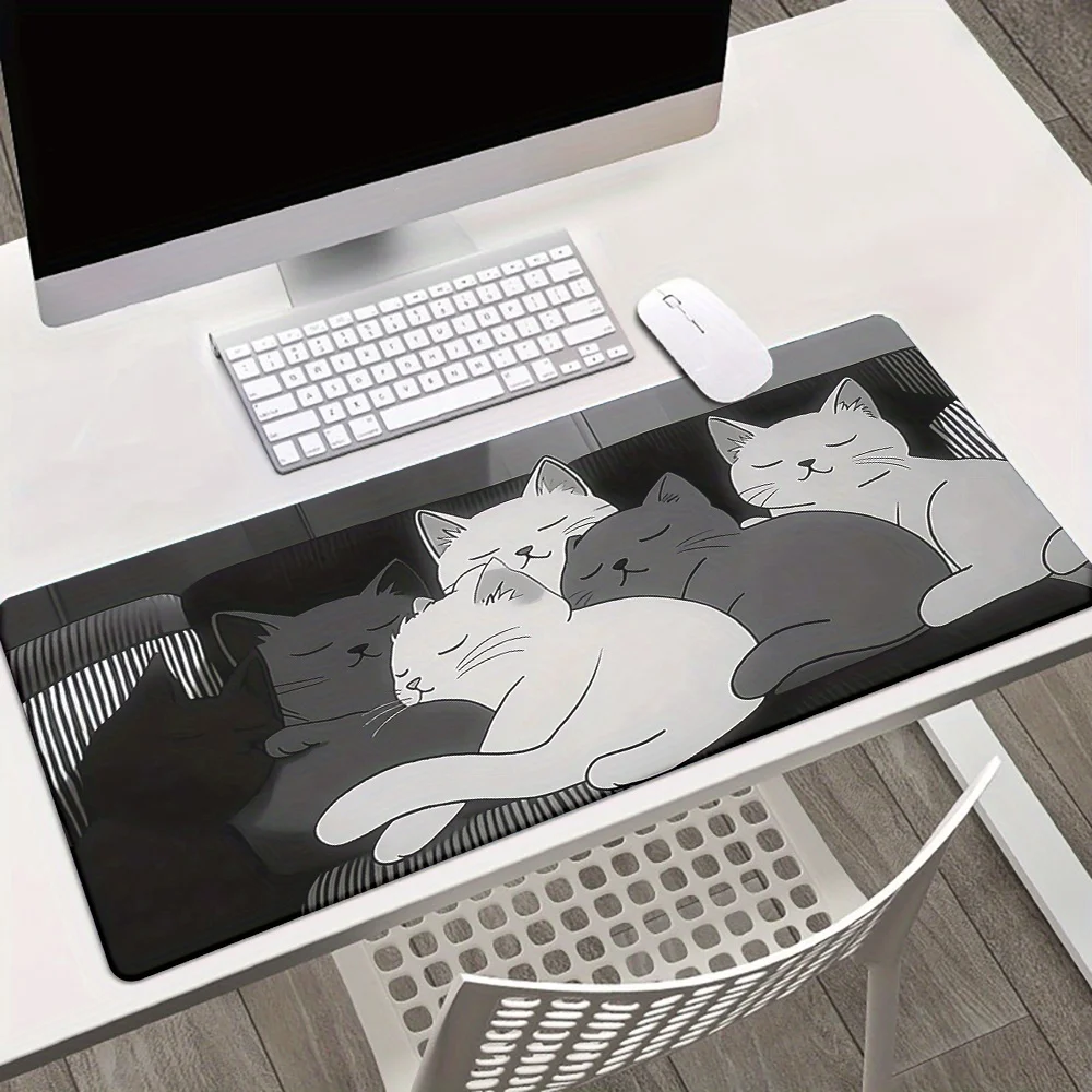 

Cute sleeping cat mousepad is a large anti-slip suitable for gaming and office use. It features a soft rubber and smooth fabric