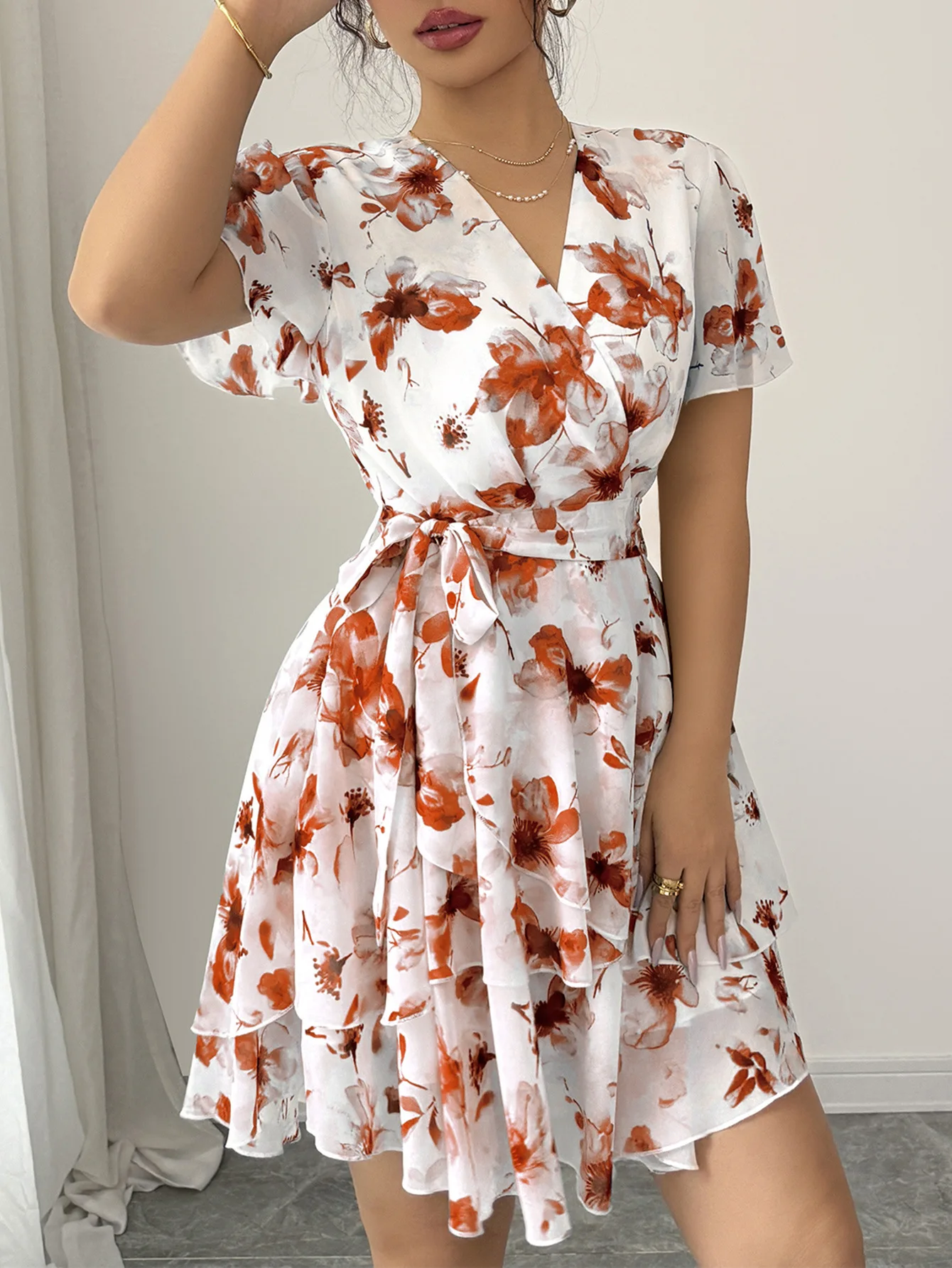 Freizeit Urlaub Bedruckter Kurzarm-Kuchenrock Sommer V-Ausschnitt Schnürung Blumendruck Plissee A-Linie Netzkleid mit Temperament