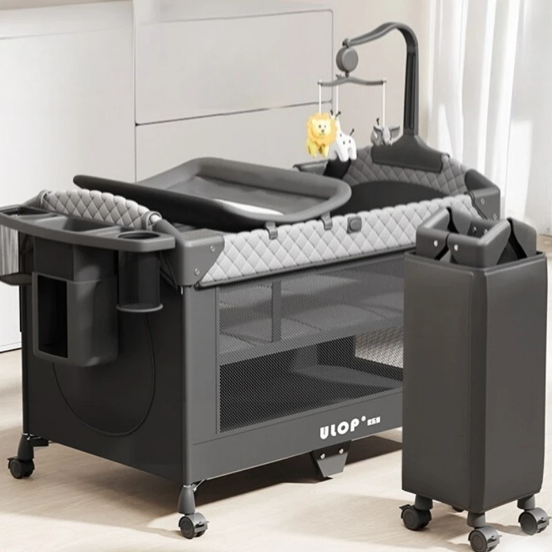 Nieuwe babyluiertafel, beweegbaar gesplitst groot bed, opvouwbaar babybedje, draagbaar pasgeboren nachtkastje, babyschommelbed