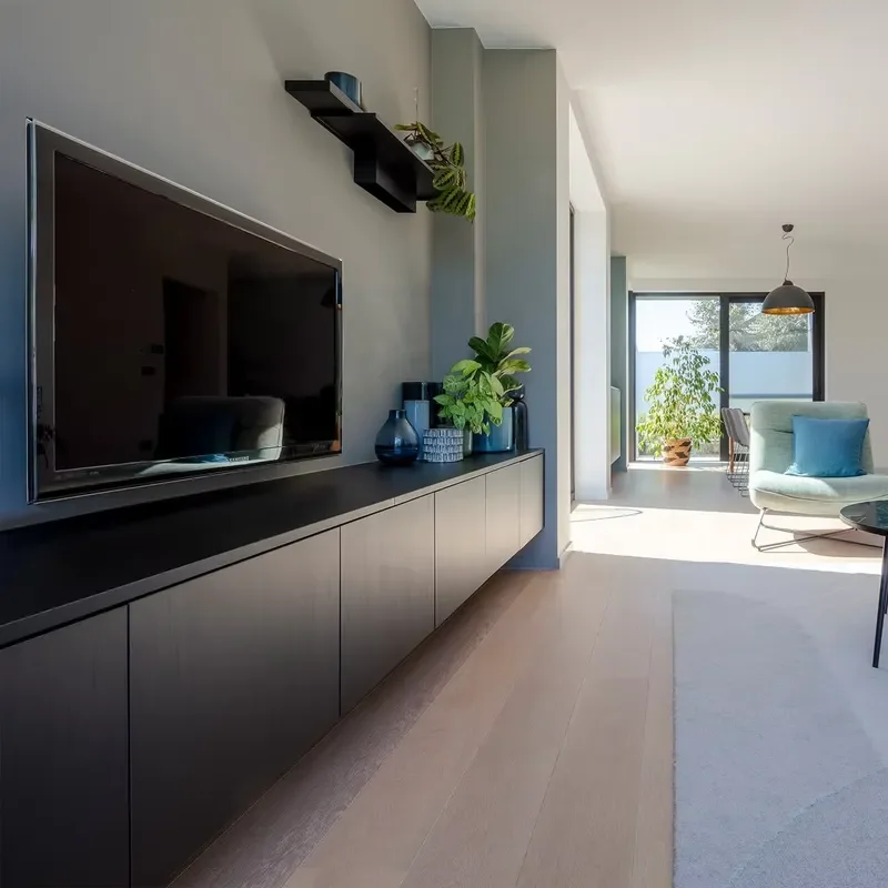 Wall-mounted TV cabinet with floating design and concealed handle, contemporary living room locker with matte grey finish