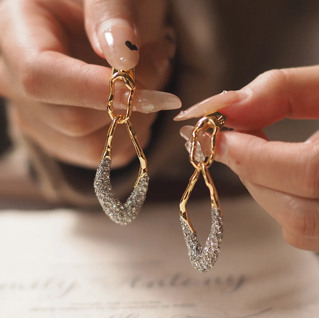 

Geometric Labyrinth · Antique Gold-Plated Metal Twists with Micro-Set Diamonds
