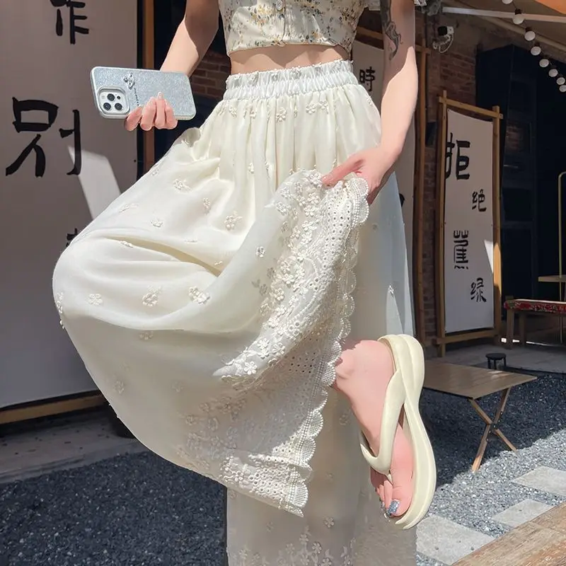 

White embroidered hollow wide-leg high waist thin elastic waist ruffle edge nine-point casual pants