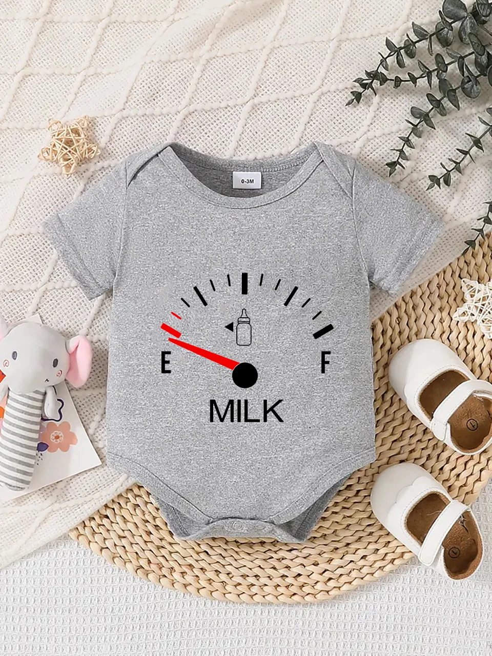 Playful letter-printed baby short-sleeve triangle bodysuit. Button closure for easy dressing, machine washable