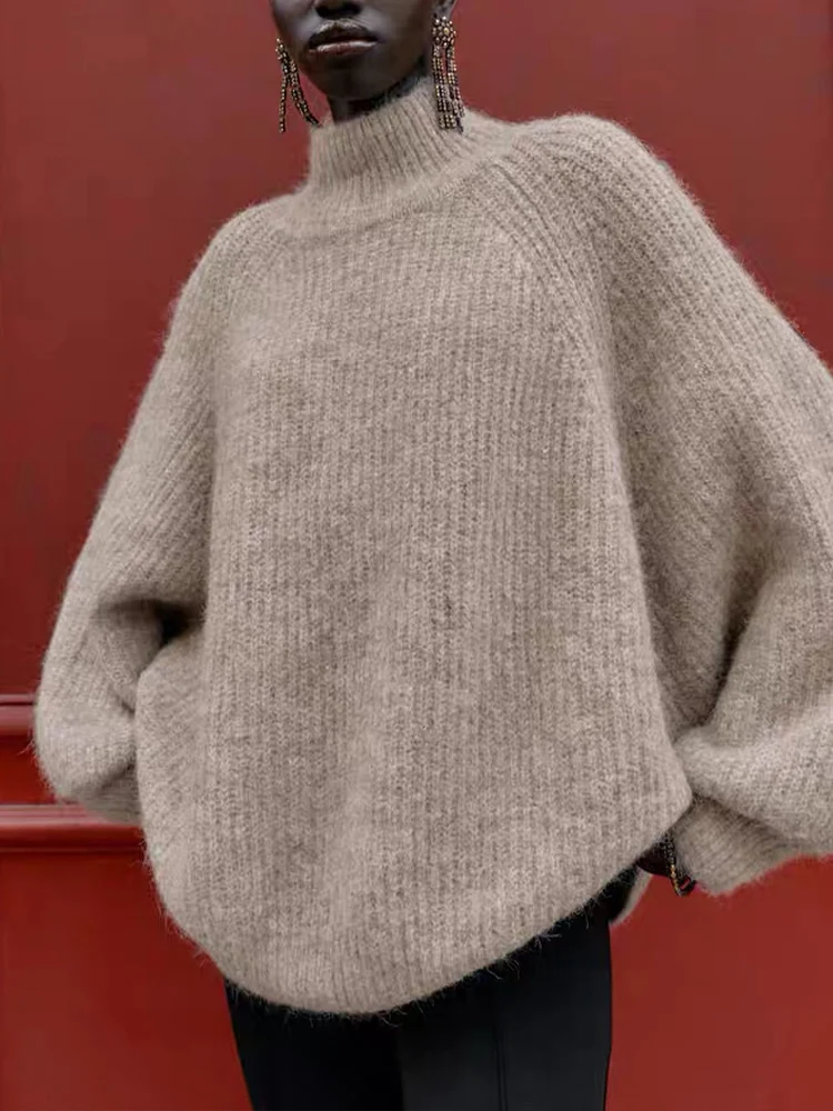 

Новое поступление в европейском стиле, женский модный универсальный элегантный однотонный вязаный свитер с высоким воротником и длинными рукавами и широкими рукавами.