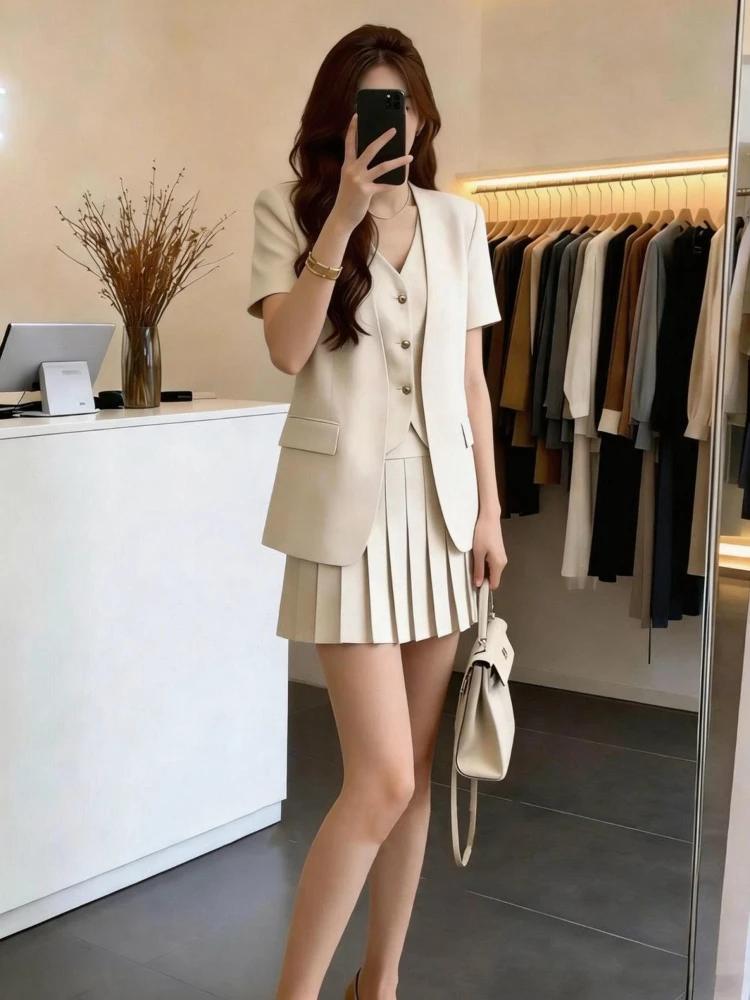 

Корейский модный комплект из двух предметов для женщин: летний новый костюм с коротким рукавом, плиссированная короткая юбка, элегантный комплект для офиса.