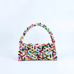 European and American same niche handmade color-blocked pearl triangle bag, fashionable and versatile hand-held bead bag