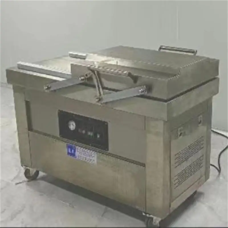 

Электрическая вакуумная машина Двухкамерная машина для запечатывания лотков для пищевых продуктов Машина для вакуумной упаковки