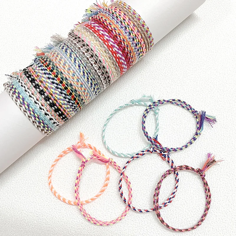 

Safety buckle four-strand colored braided cotton thread handmade rope bracelet lucky bracelet tassel friendship rope
