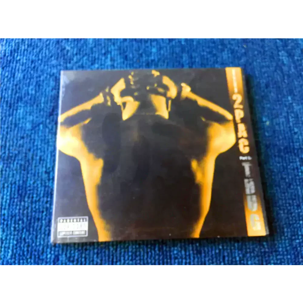 

CDThe Best of 2Pac Part 1 ThugThe Lyrics Focus on Street Life and Survival Struggles, а 2Pac's Sing is Both Hard-core