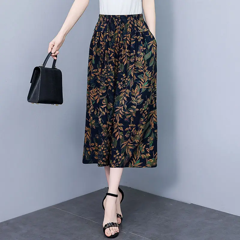 高齢者の女性の夏の新綿シルクフラワーパンツ女性の 7 分ワイドレッグパンツ弾性ハイウエストルーズスカートパンツ