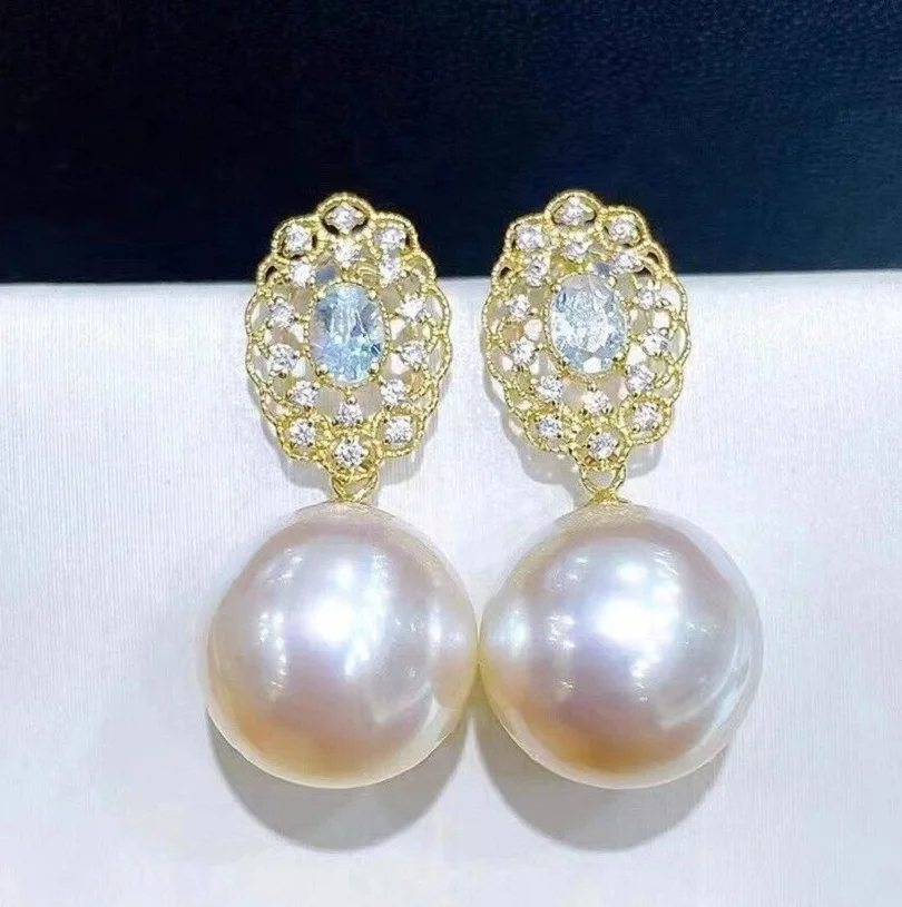 

Gorgeous oversized AAA 10-11mm circular natural South China Sea white pearl earrings 925S