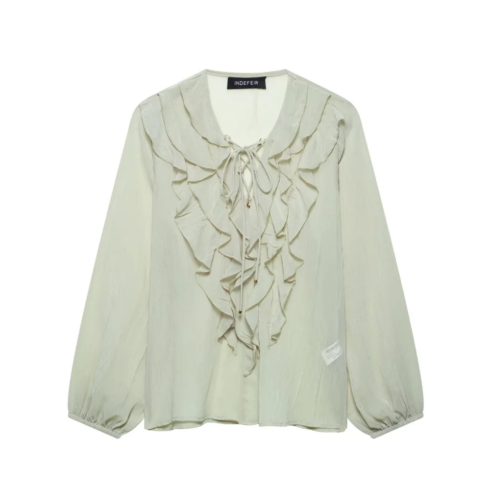 

Женская рубашка свободного кроя с воротником и круглым вырезом, длинными рукавами, пуговицами, многослойными рюшами по краям, украшение на шнуровке, брызги