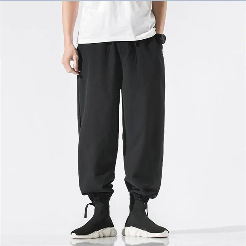 Plus größe Männer Jogger baumwolle Leinen Hosen Männer Lose Beiläufige Elastische taille Schwarz Grau weiß street Hosen große größe 5XL 6XL 7XL