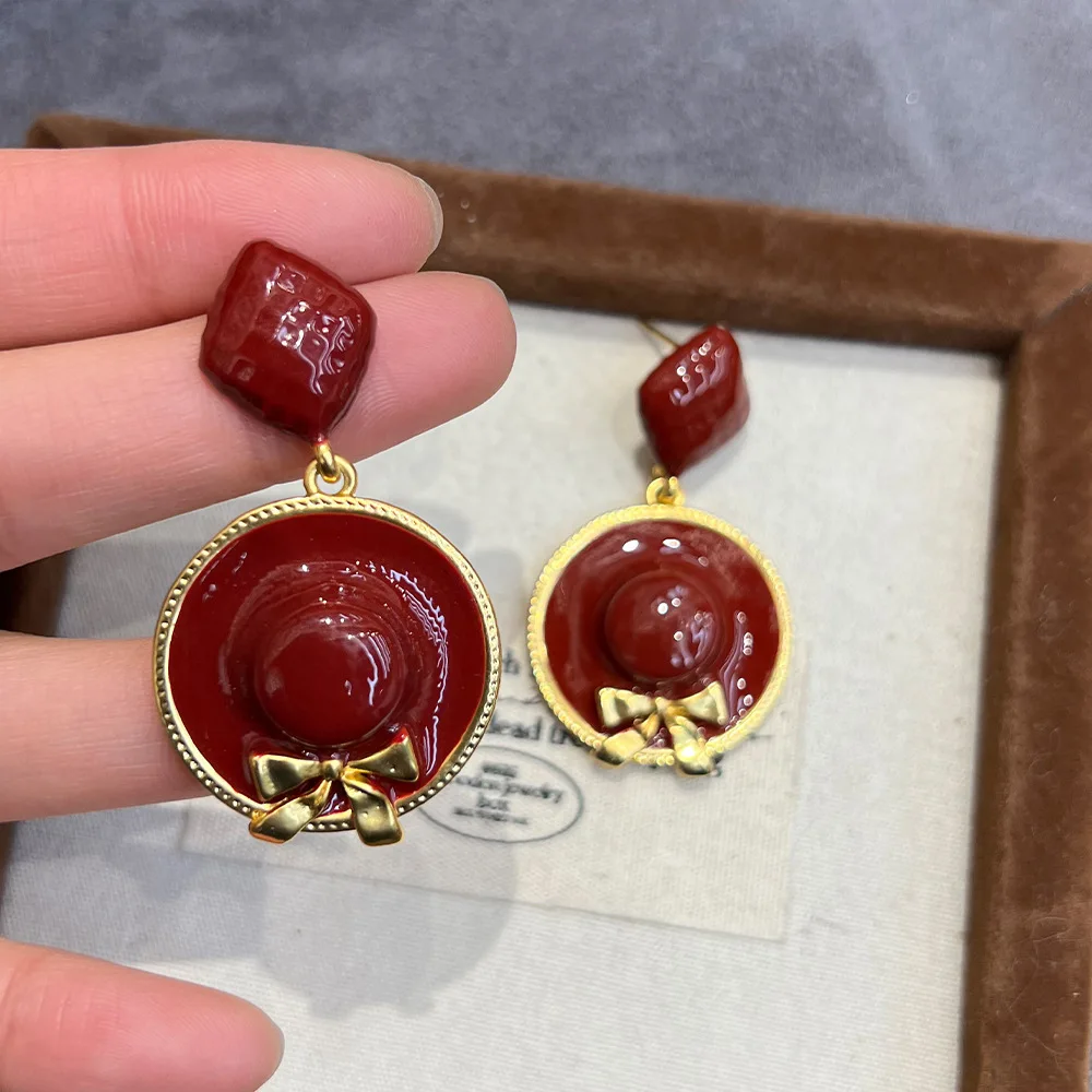 Star same creative earrings copper gold plated retro enamel oil dripping angola red bow straw hat earrings