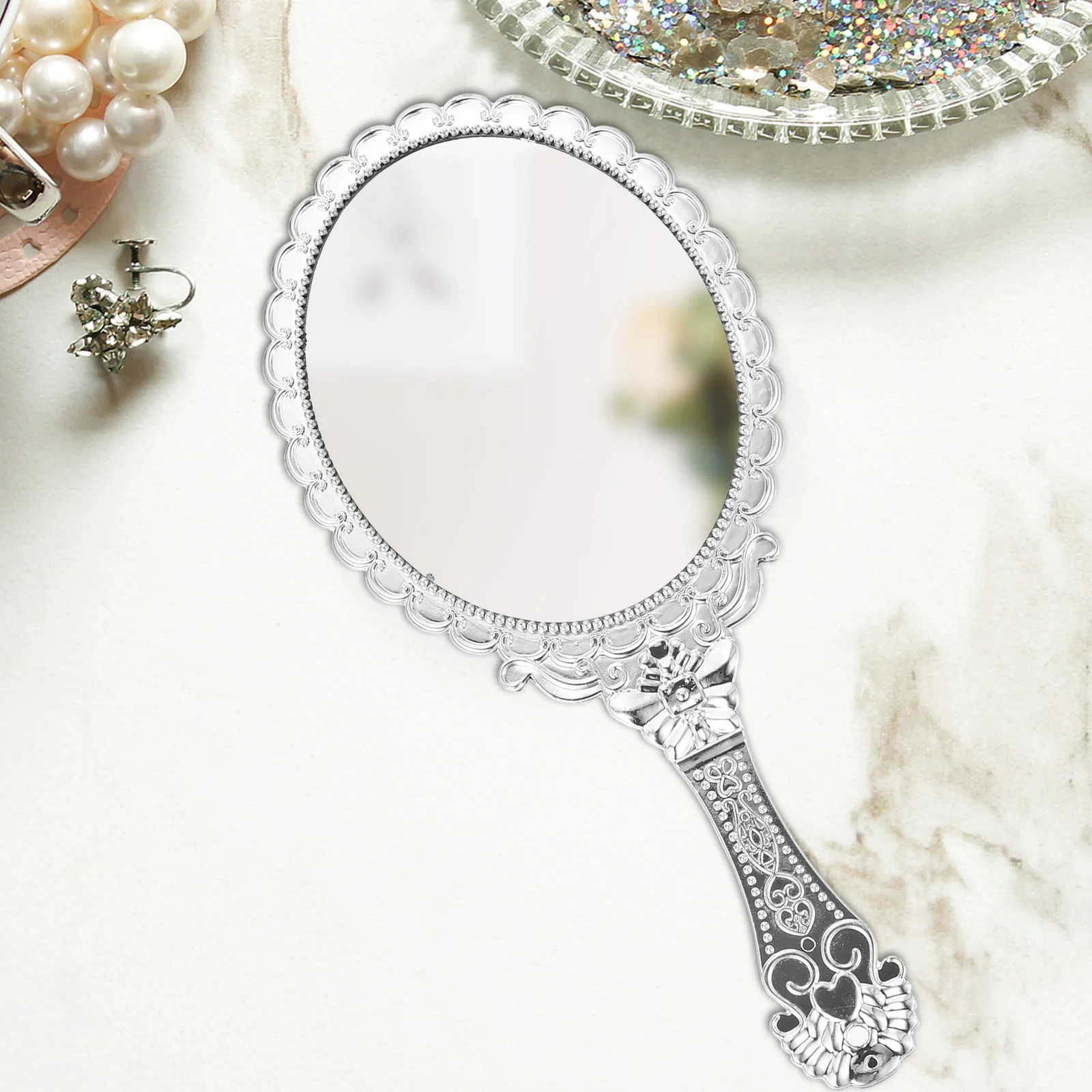 シックな手持ちミラー ポータブル旅行用化粧鏡 小さな丸いツール 彫刻されたハンドル付き 女性向け 全年齢対象