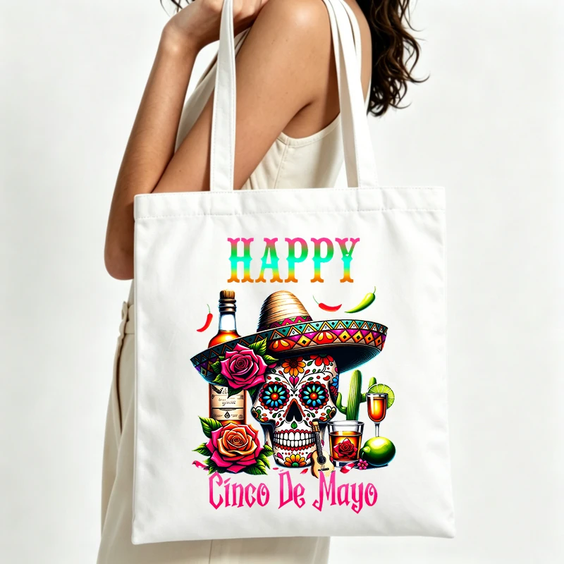 skull graphic canvas tote bag with typography print, ideal for Cinco de Mayo celebrations and casual outings