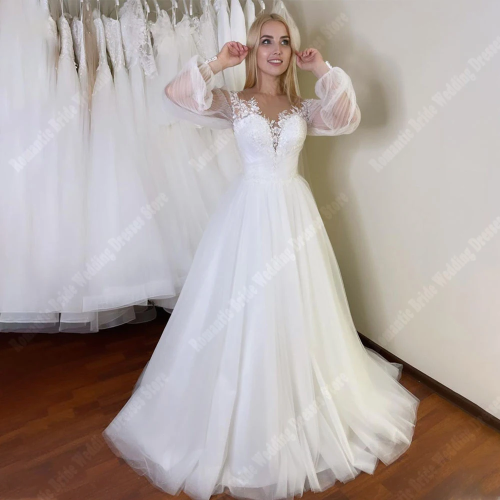 Affascinanti abiti da sposa da donna con stampa in pizzo abiti da sposa Vintage a maniche lunghe con scollo a v superficie in Tulle Princess Vestidos De Novia