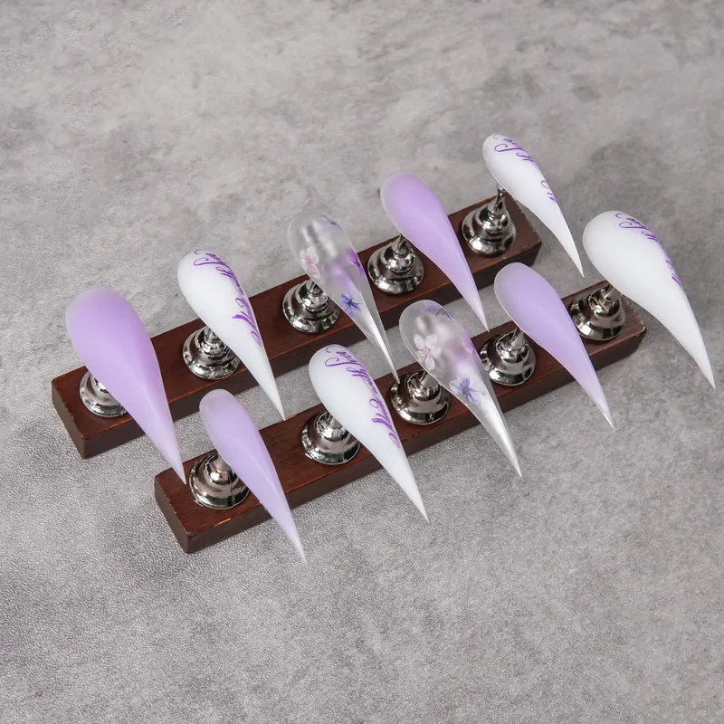 Long dragon claw press-on nails, sharp and pointed, semi-transparent base color, hand-painted English fonts