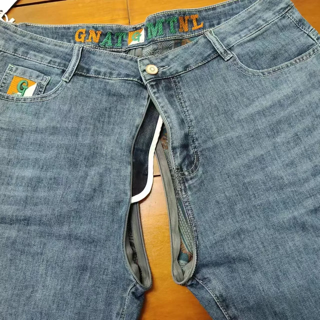 Pantaloncini di jeans da uomo Pantaloni aperti con cerniera invisibile Pantaloni estivi sottili di fascia alta elastici larghi con stampa dritta Pantaloni medi a cinque punti sottili