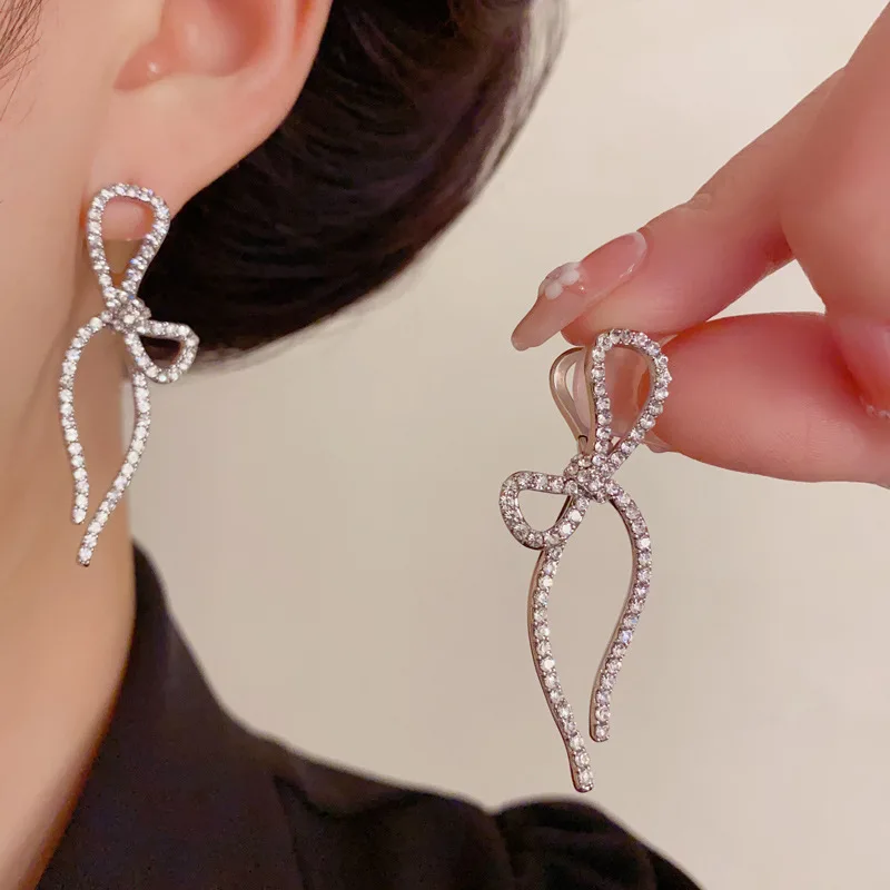 Light luxury versatile full diamond bow long fringed ear buckle exquisite personality fashion super flash earrings