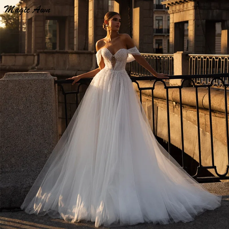 

Magic Awn Luxury Wedding Dresses For Women Off The Shoulder Pearls Beaded Illusion Tulle Beach Bridal Gowns 2024 Vestidos Novia